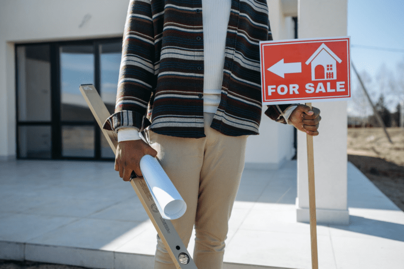 realtor with sign